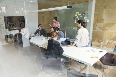 Creative team of business people having discussion in conference room stock photo