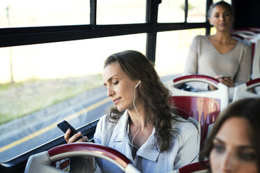 Female passengers traveling in tour bus - CAVF38514