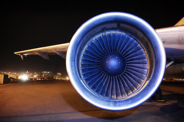 Aircraft jet engine on runway at night - CAVF38590