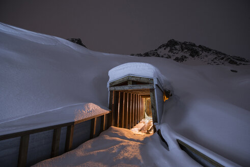 Entrance of illuminated gold mining tunnel at Independence Mine State Park - CAVF38708