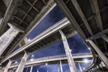 Low angle view of multiple lane highway against sky - CAVF38769