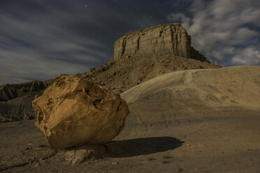 Low angle scenic view of rock formation against cloudy sky at Grand Staircase-Escalante National Monument during night - CAVF38773