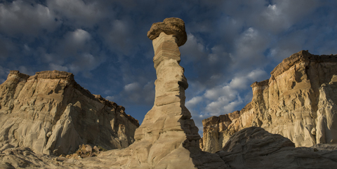 Low angle view of Wahweap Hoodoos against cloudy sky stock photo