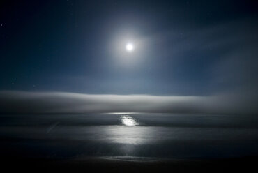 Scenic view of sea against sky at night - CAVF39029