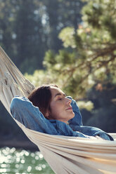 Woman sleeping on hammock - CAVF39613