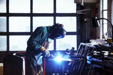 Worker welding in workshop - CAVF39891