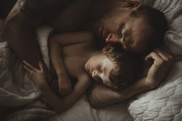 High angle view of father and son sleeping on bed - CAVF40163