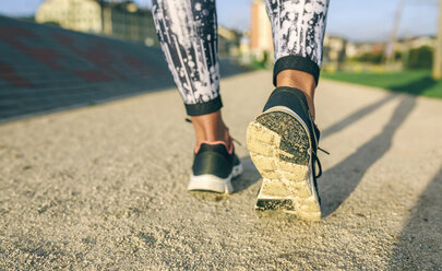 Low section of woman jogging at park - CAVF40847