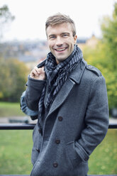 Portrait of happy young man in park - MASF04714