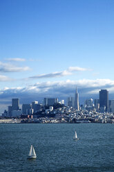 Sailboats on San Francisco Bay by city against blue sky - CAVF42289