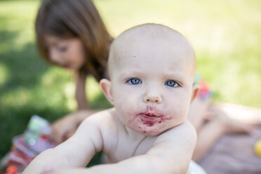 High angle portrait of baby girl with sister in background - CAVF42404