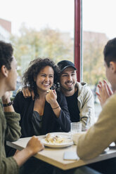 Happy university students in cafe - MASF04980