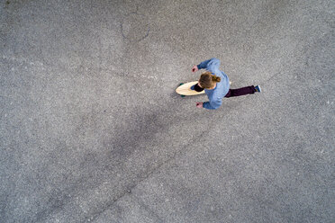 Man longboarding, top view - STSF01487