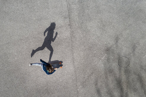 Woman longboarding, top view - STSF01488