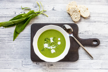 Dish of ramson soup garnished with ramson and cream - SARF03664