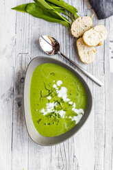 Bowl of ramson soup garnished with ramson and cream - SARF03665