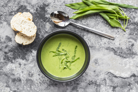 Bowl of ramson soup garnished with ramson stock photo