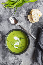 Bowl of ramson soup garnished with ramson and cream - SARF03667