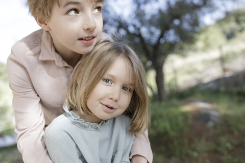 Portrait of brother and little sister stock photo