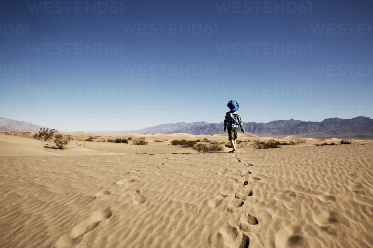 Single Sand Dune In The Desert Against Clear Blue Sky Stock Photo