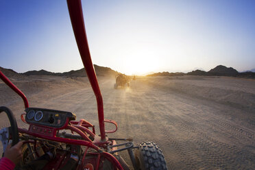 Beach buggies on dessert against clear sky during sunny day - CAVF43450