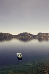 High angle view of boat in water at Crater Lake National Park against clear sky - CAVF43595