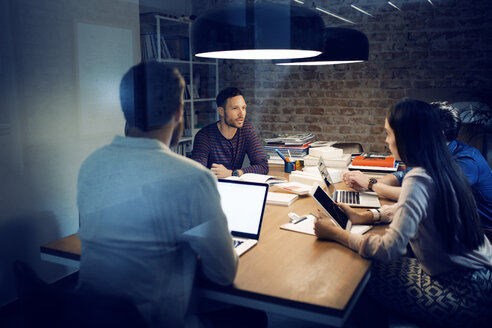 Business people having discussion in conference room - CAVF43907