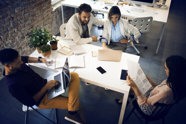 Business people working at table in office - CAVF43929