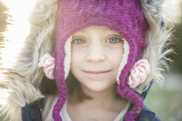 Close-up portrait of cute girl wearing knit hat outdoors - CAVF44144