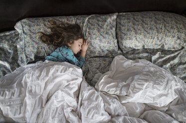 High angle view of girl sleeping on bed - CAVF44185