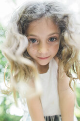 Low angle portrait of confident girl at park - CAVF44204