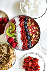 Overhead view of fruits smoothie with ingredients arranged on table - CAVF44244