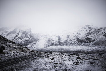 Scenic view of snowcapped mountains during foggy weather - CAVF44617