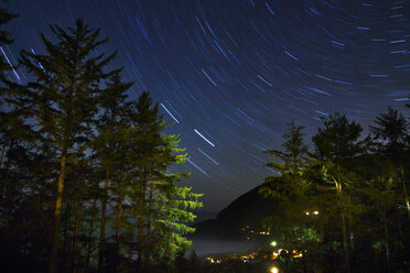 Low angle view of star trails in sky - CAVF44927