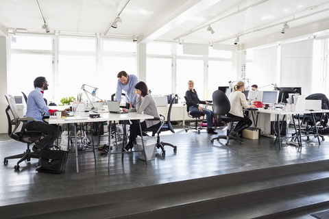 Multi-ethnic group of business people working in office stock photo