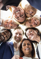 Directly below shot of multi-ethnic business people forming huddle - MASF06465