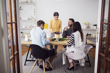 Happy friends enjoying party at dinning table in home - CAVF45125