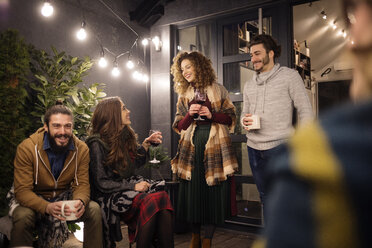 Friends enjoying drinks in party at backyard - CAVF45198