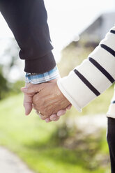 Senior couple holding hands in park - MASF06494