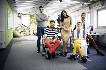 Portrait of confident business team in creative office - CAVF45640