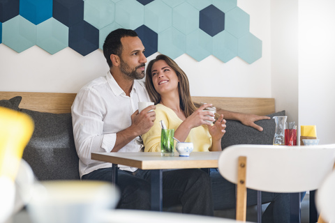 Couple in love drinking coffee in a cafe stock photo