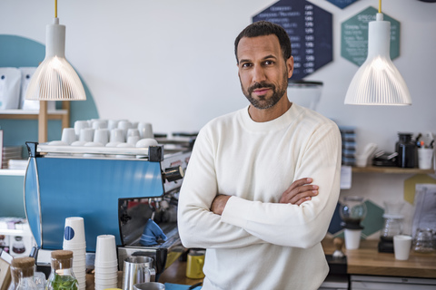 Portrait of confident owner of a cafe stock photo