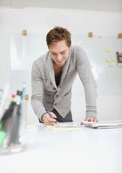 Man working at desk - MASF06692