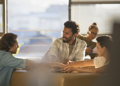 Creative business people connecting hands in huddle stock photo