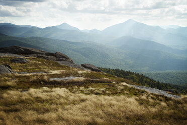 Scenic view of mountains against cloudy sky - CAVF45888