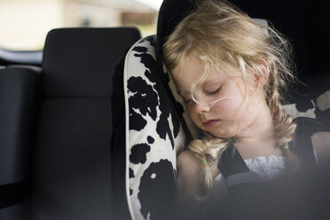 Tired girl sleeping in car - CAVF45925