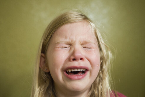 Sad girl crying at home - CAVF45931