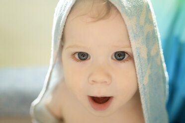 Portrait of cute boy with towel on head - CAVF45974