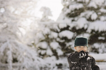 Portrait of boy in warm clothing at forest - CAVF45975