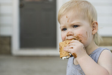 Close-up of cute boy eating smore - CAVF46006